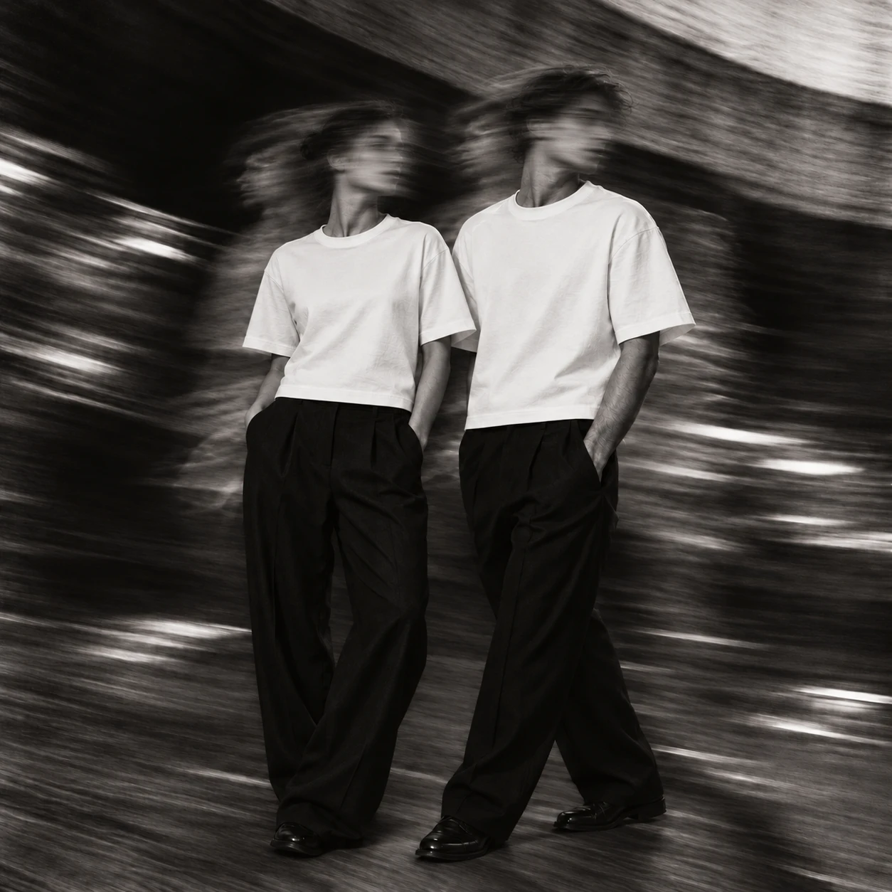 CORE — woman and man in short boxy white tees and black trousers